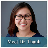 The image features a person with glasses smiling at the camera, wearing a blue shirt and a black lanyard. They are positioned against a neutral background with their name Dr. Thanh visible below them.